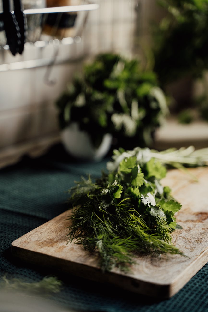 Fresh herbs on a wooden cutting board